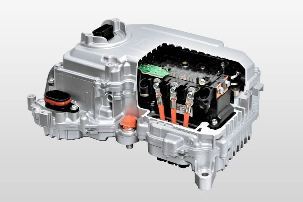 An electric vehicle power control unit with its high-voltage inverter section exposed