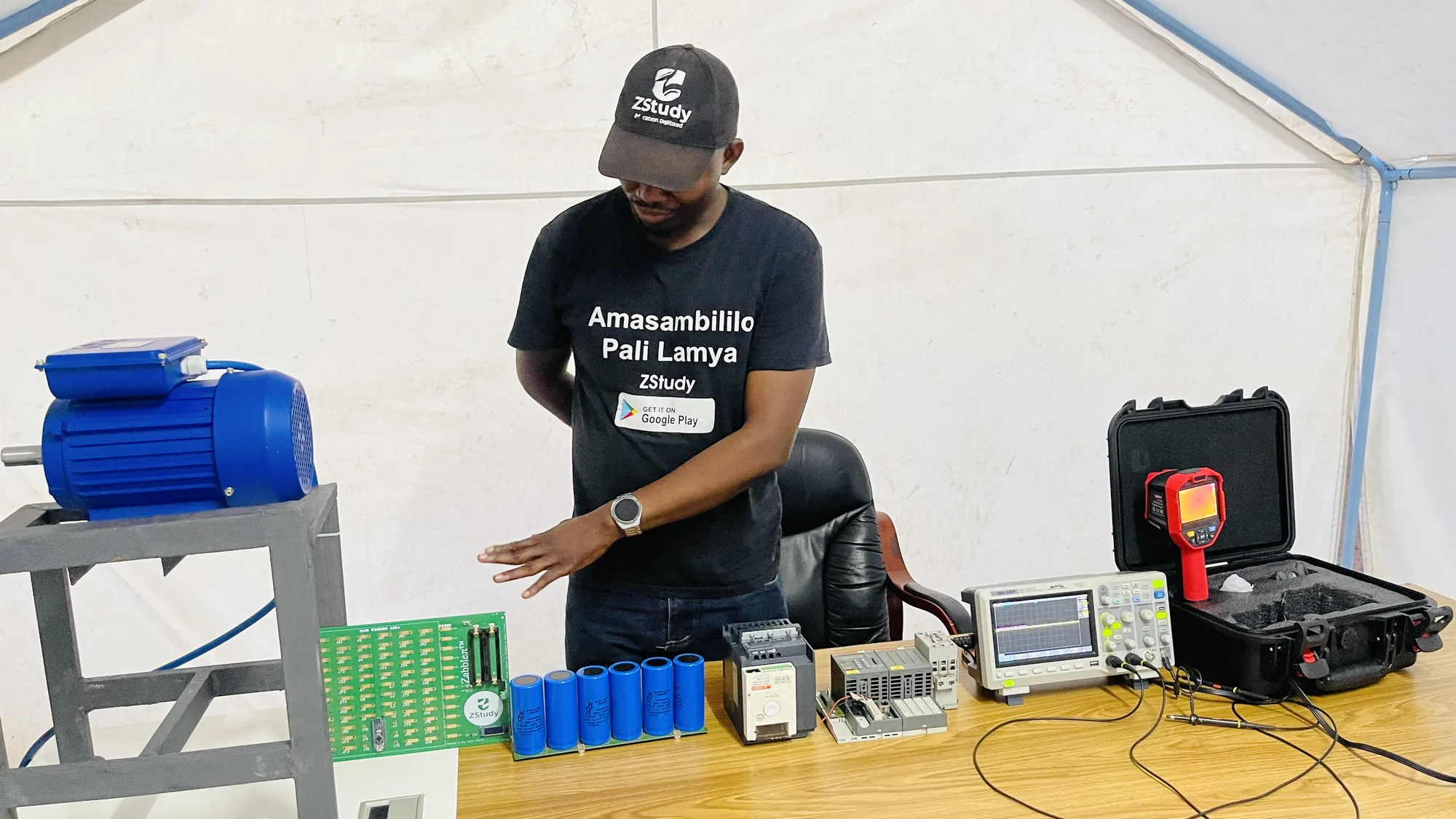 Eng. Cephas Kalembo demonstrating a motor-control rig