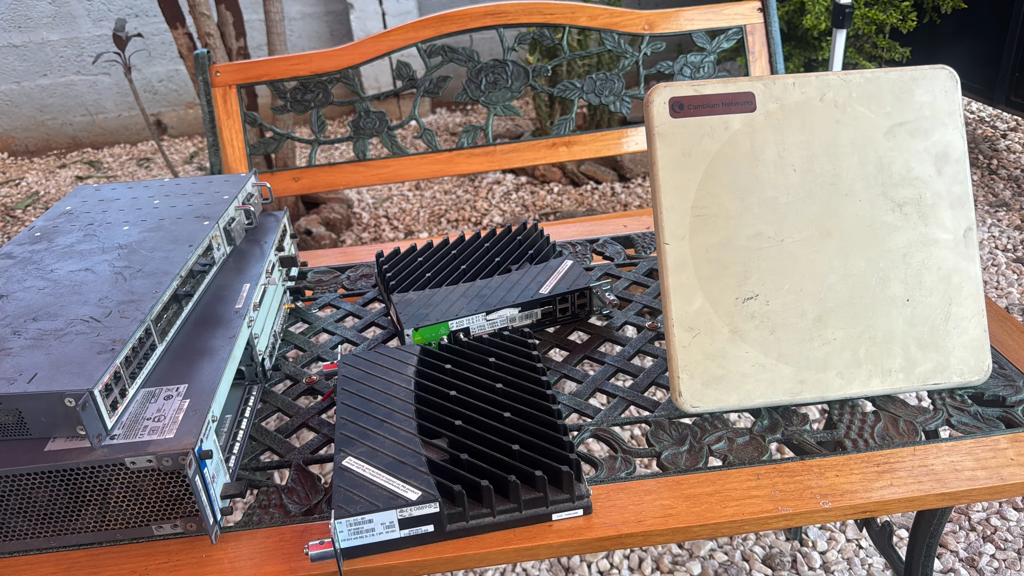 Remote radio units with finned heatsinks lined up for inspection
