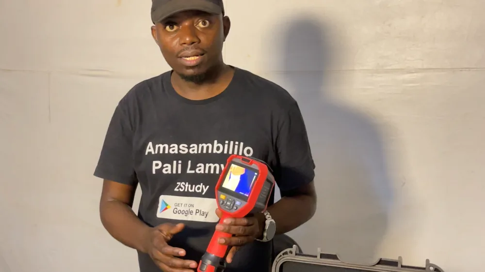 Engineer holding a handheld thermal camera