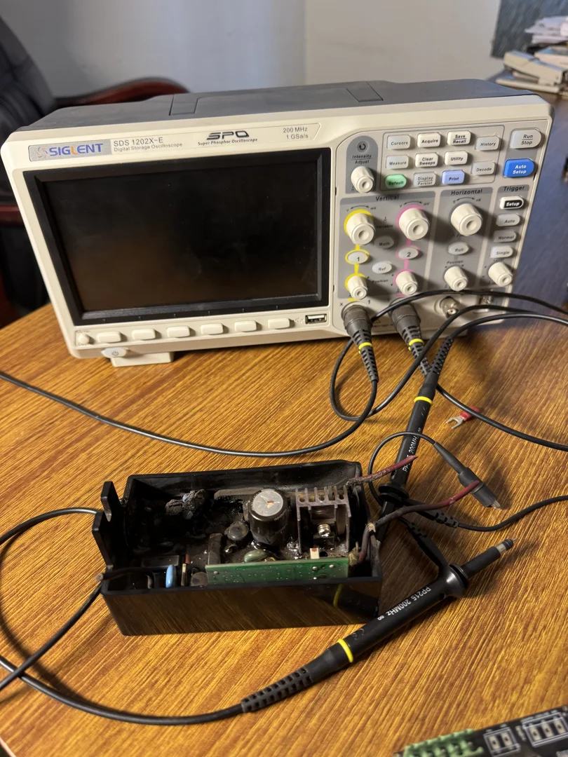 technician inspecting a circuit board